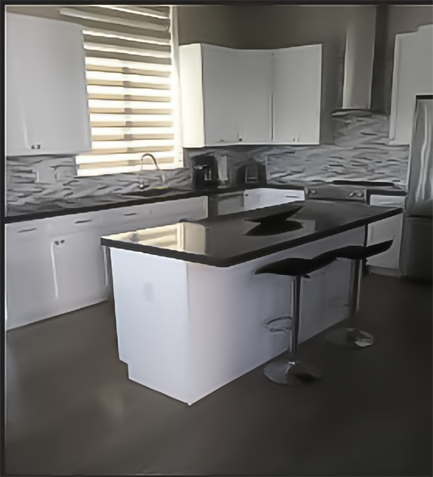 Spotless kitchen with black granite countertops — It Needs to be Perfect LLC